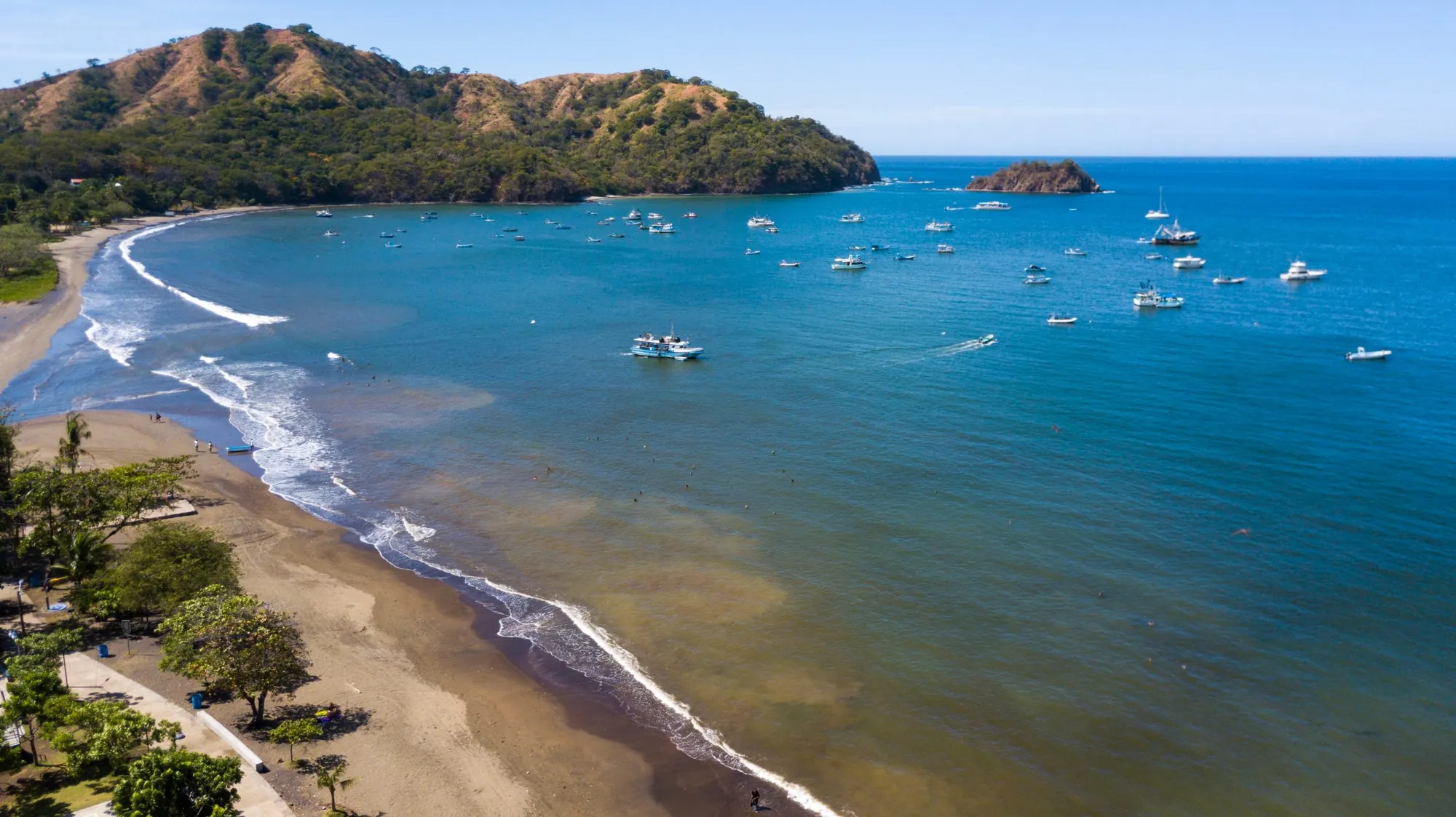 Boats anchored in the bay off Playas del Coco beach in Guanacaste, Costa Rica